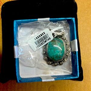 Turquoise and silver tone oval pendant